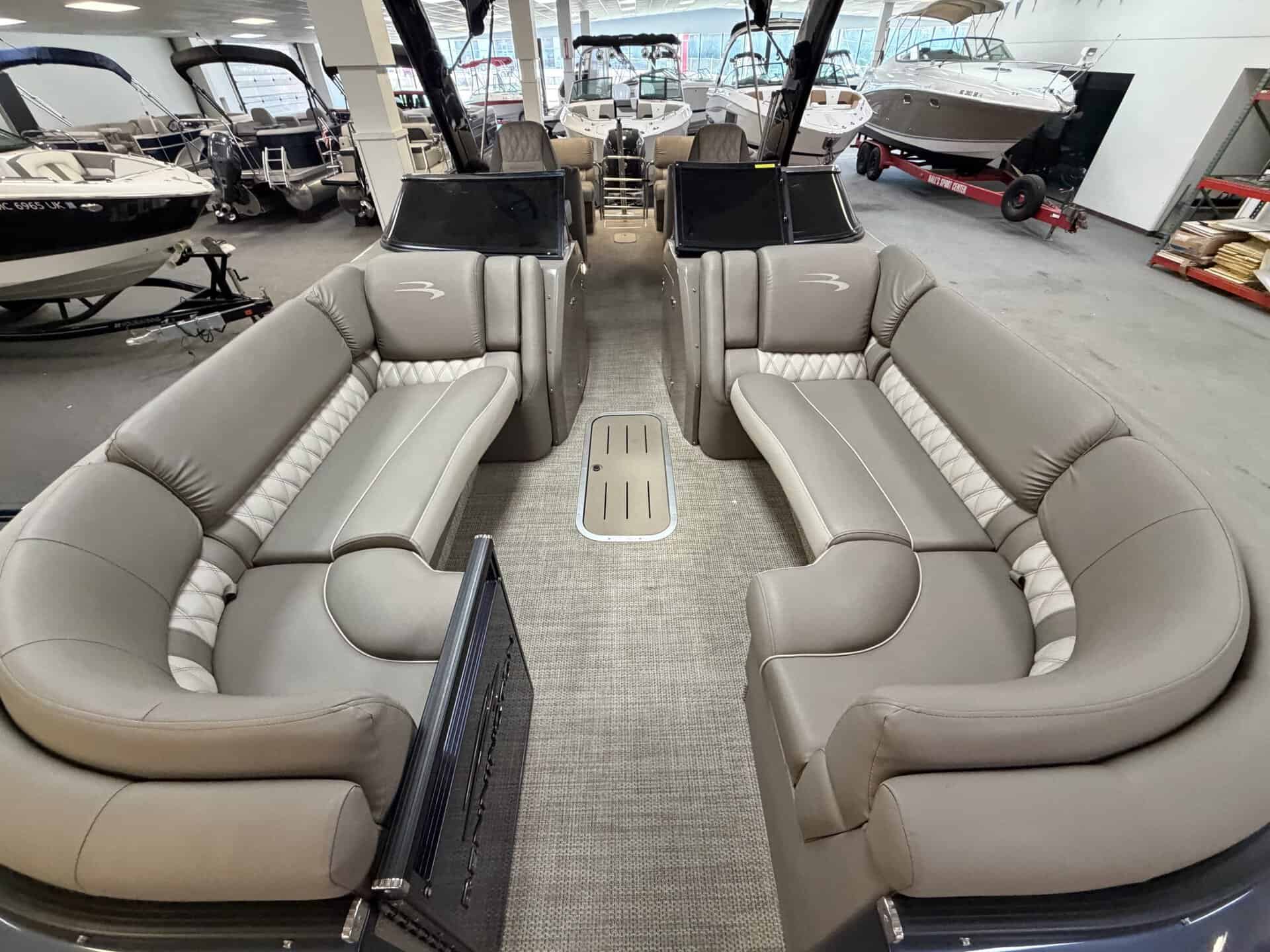 Luxury boat seating with dual captain chairs and spacious lounge area.