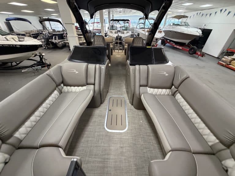 Interior view of a Bennington 25QXFBWA pontoon boat at Hall's Sport Center.