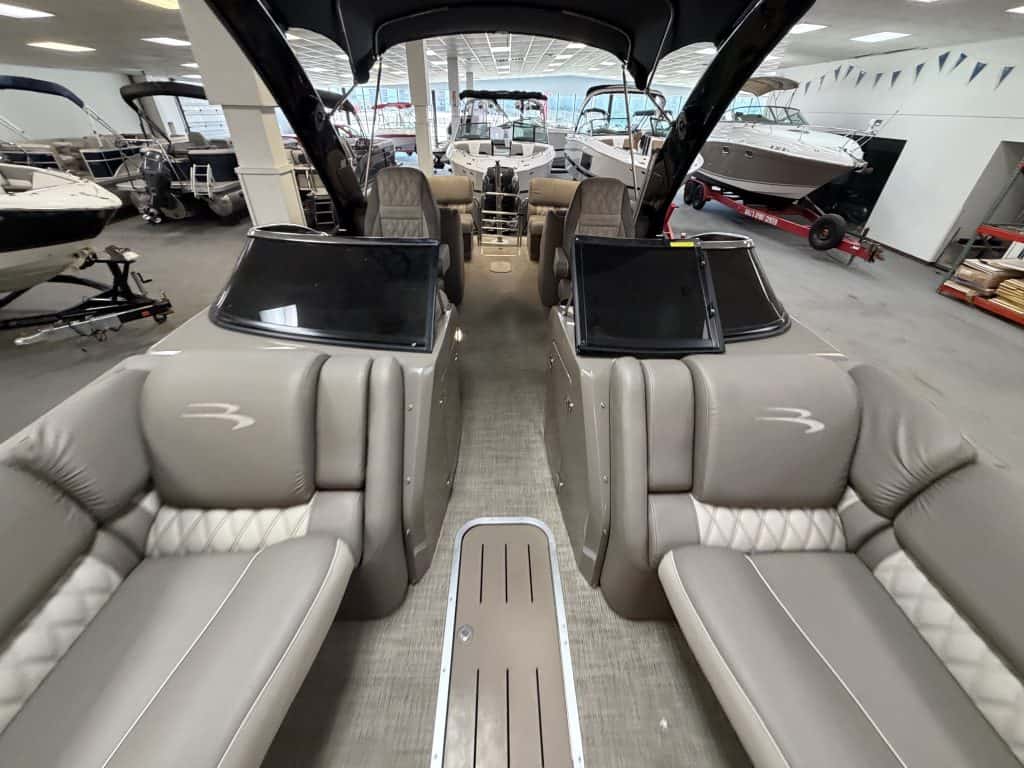 Luxury boat interior with seating and navigation screens at Hall's Sport Center.