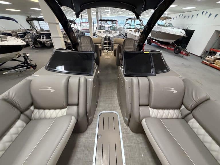 Luxury boat interior with seating and navigation screens at Hall's Sport Center.