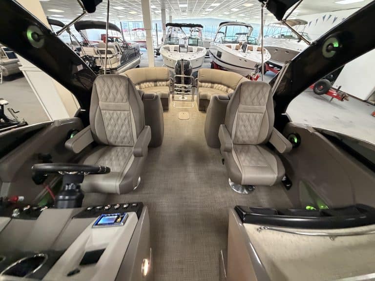 Luxury boat interior with seating and controls at Hall's Sport Center.