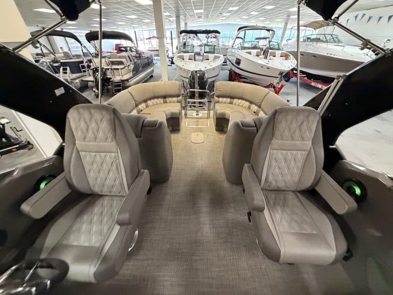 Luxury boat interior with seating and navigation area at Hall's Sport Center.