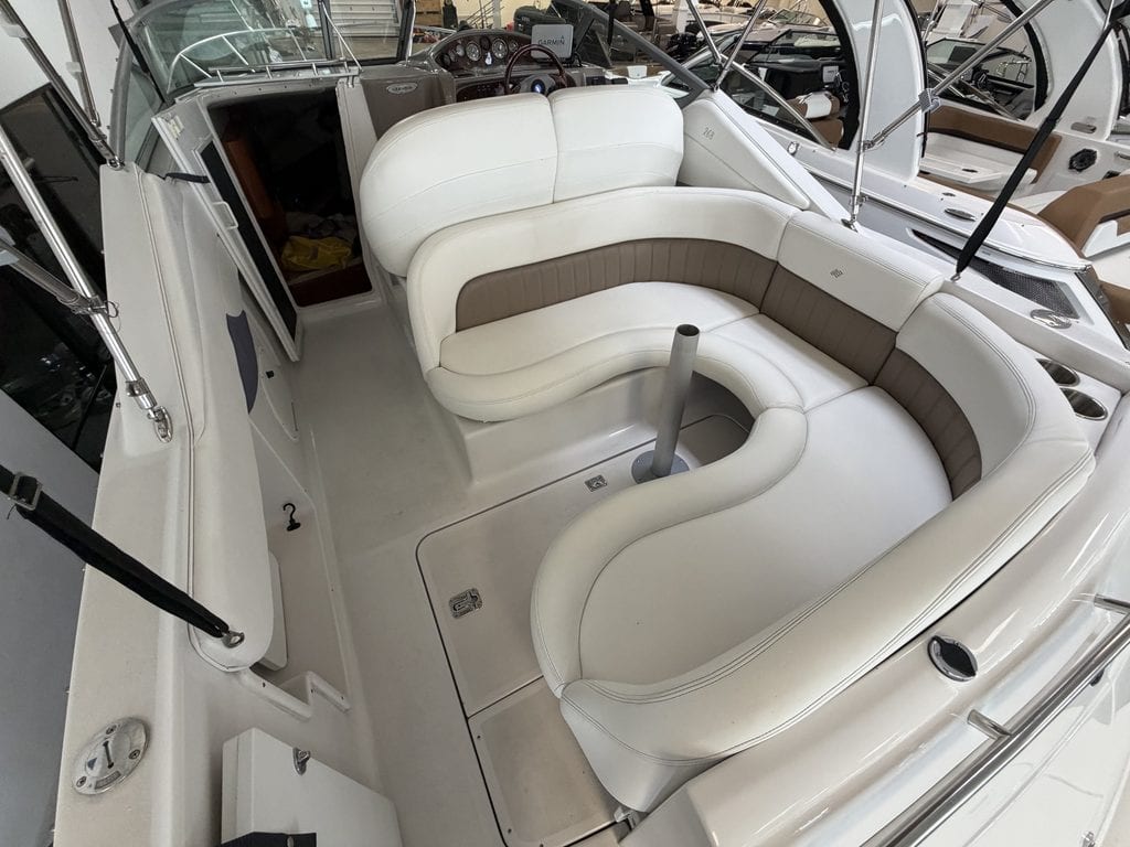 Interior view of a 2004 Four Winns 268 VISTA boat with white seating.