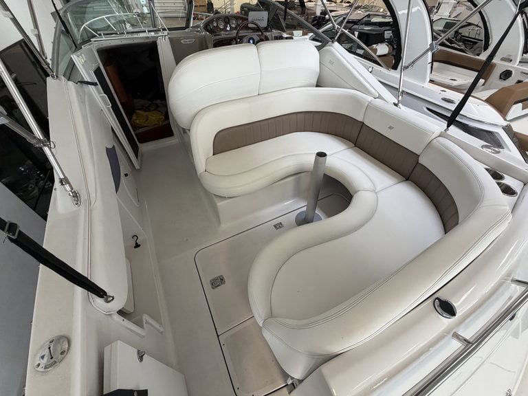 Interior view of a 2004 Four Winns 268 VISTA boat with white seating.