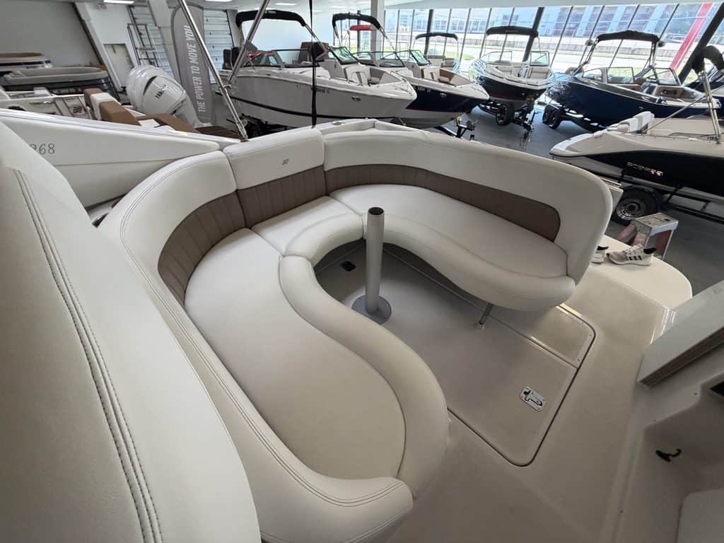 Comfortable white and brown boat seating inside Hall's Sport Center.