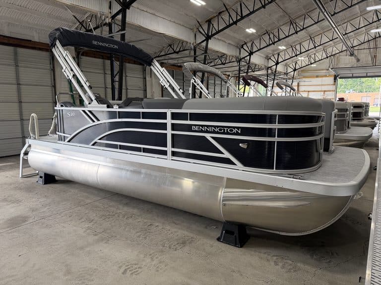 Bennington 20S1 SL pontoon boat inside Hall's Sport Center.