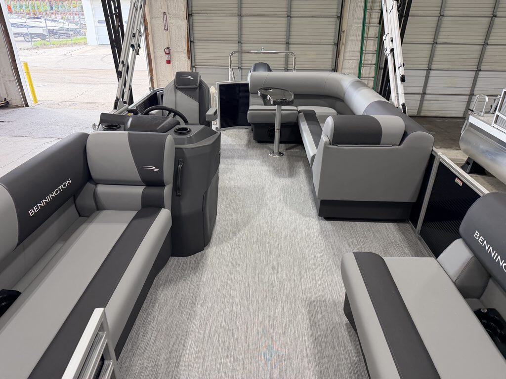 Bennington 20S1 SL pontoon boat interior with seating and steering console.
