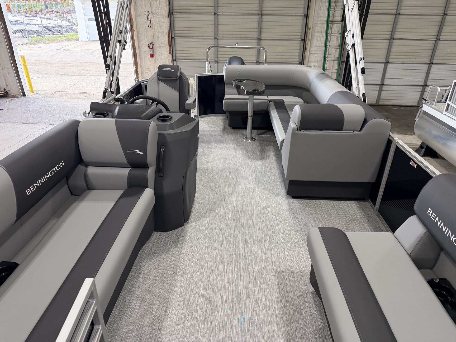 Bennington 20S1 SL pontoon boat interior with seating and steering console.