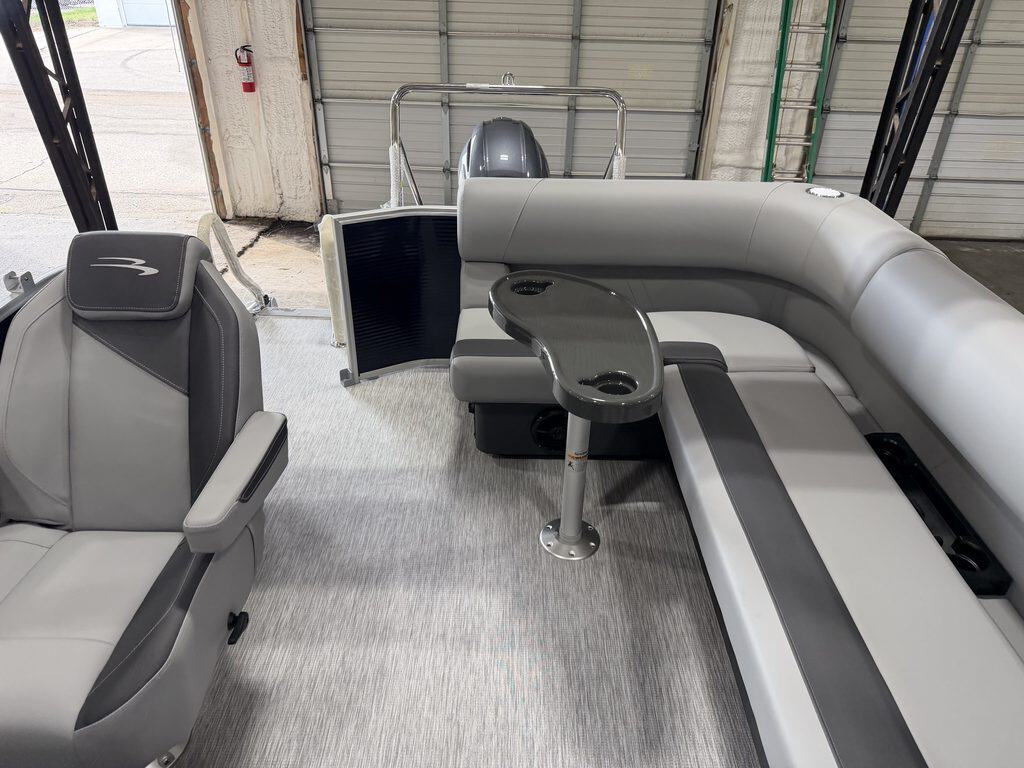 Bennington 20S1 SL pontoon boat interior with seating and steering console.