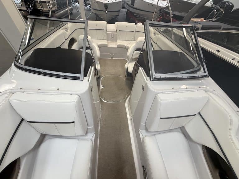 Interior view of a 2011 Four Winns 220 Horizon boat with seating and windshield.