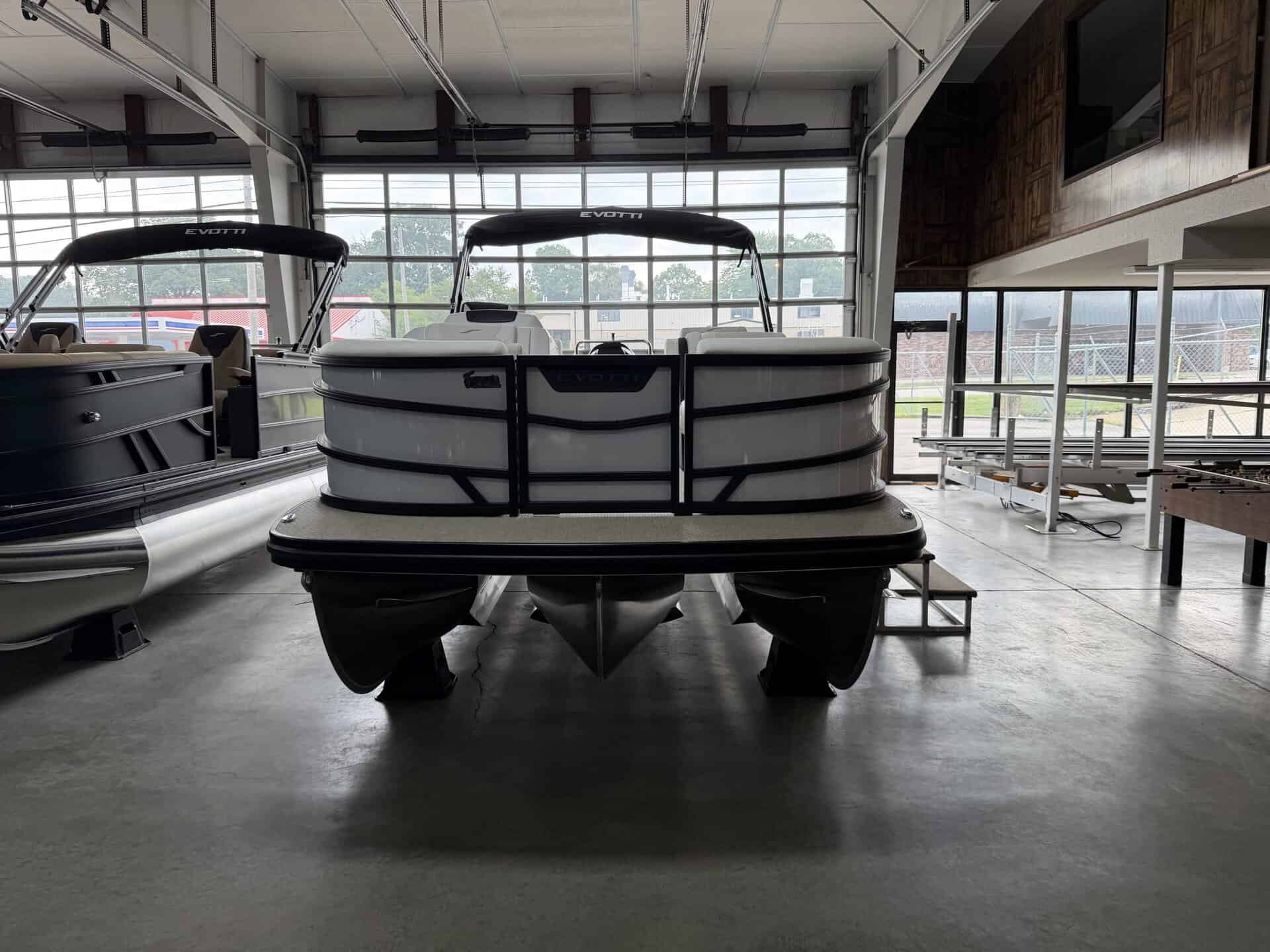 Pontoon boat displayed at Hall's Sport Center for sale or demo.
