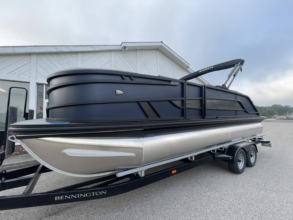 Luxury boat on trailer at Hall's Sport Center with sleek design.