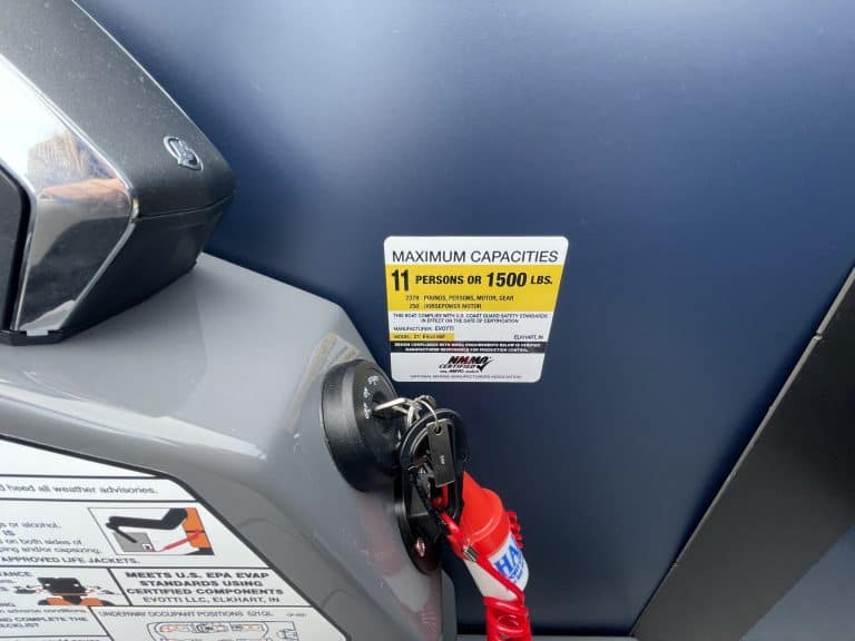 Close-up of fitness equipment with maximum capacity label at Hall's Sport Center.