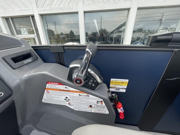 Electric scooter handlebar with safety labels at Hall's Sport Center.