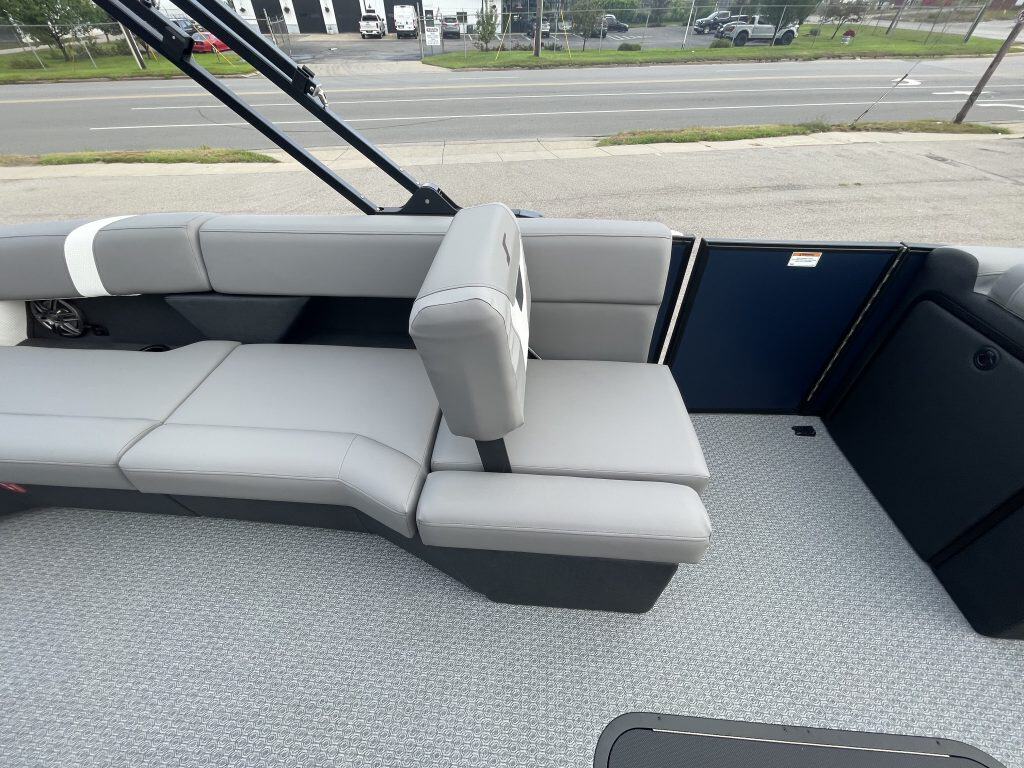 Comfortable boat seating with large windows and scenic view.