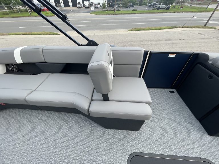 Comfortable boat seating with large windows and scenic view.