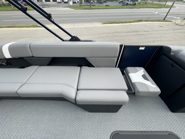 Boat interior with seating and dashboard at Hall's Sport Center.