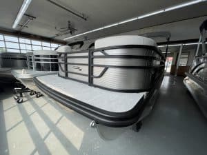Bennington 22 S1SR pontoon boat displayed indoors at Hall's Sport Center.