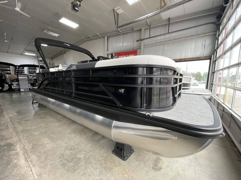 Bennington 22 S1SR pontoon boat inside Hall's Sport Center.