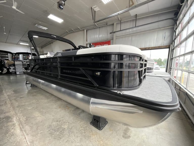 Bennington 22 S1SR pontoon boat inside Hall's Sport Center.