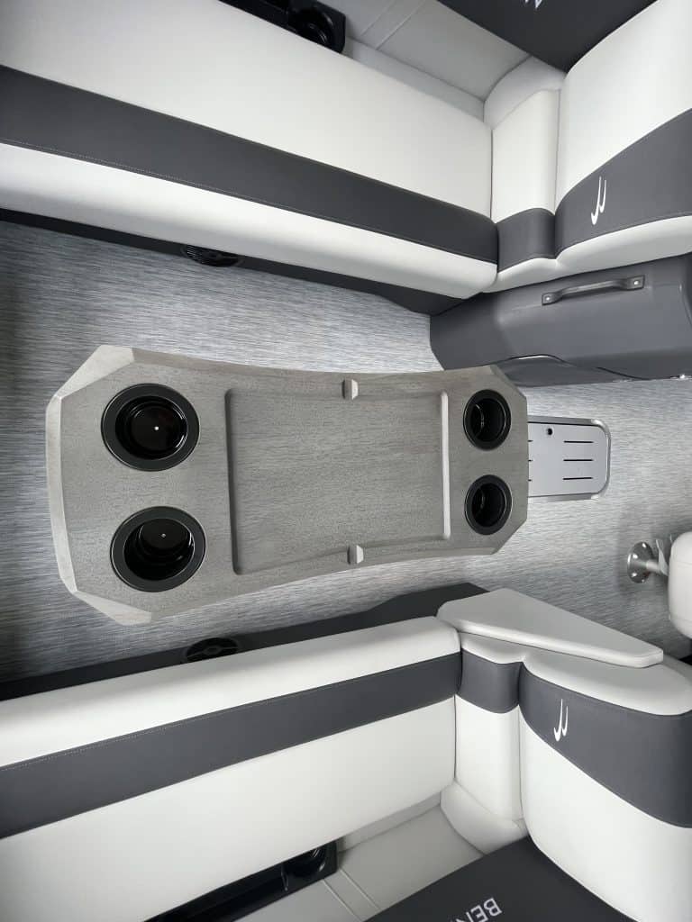 Close-up of boat interior with seating and speaker system.