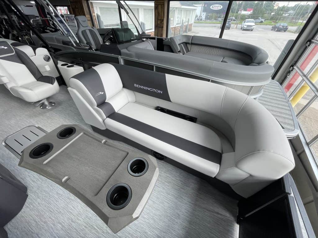 Bennington pontoon boat interior with seating and steering area.
