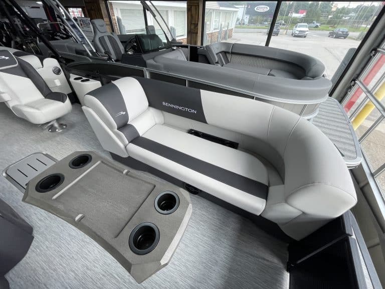 Bennington pontoon boat interior with seating and steering area.