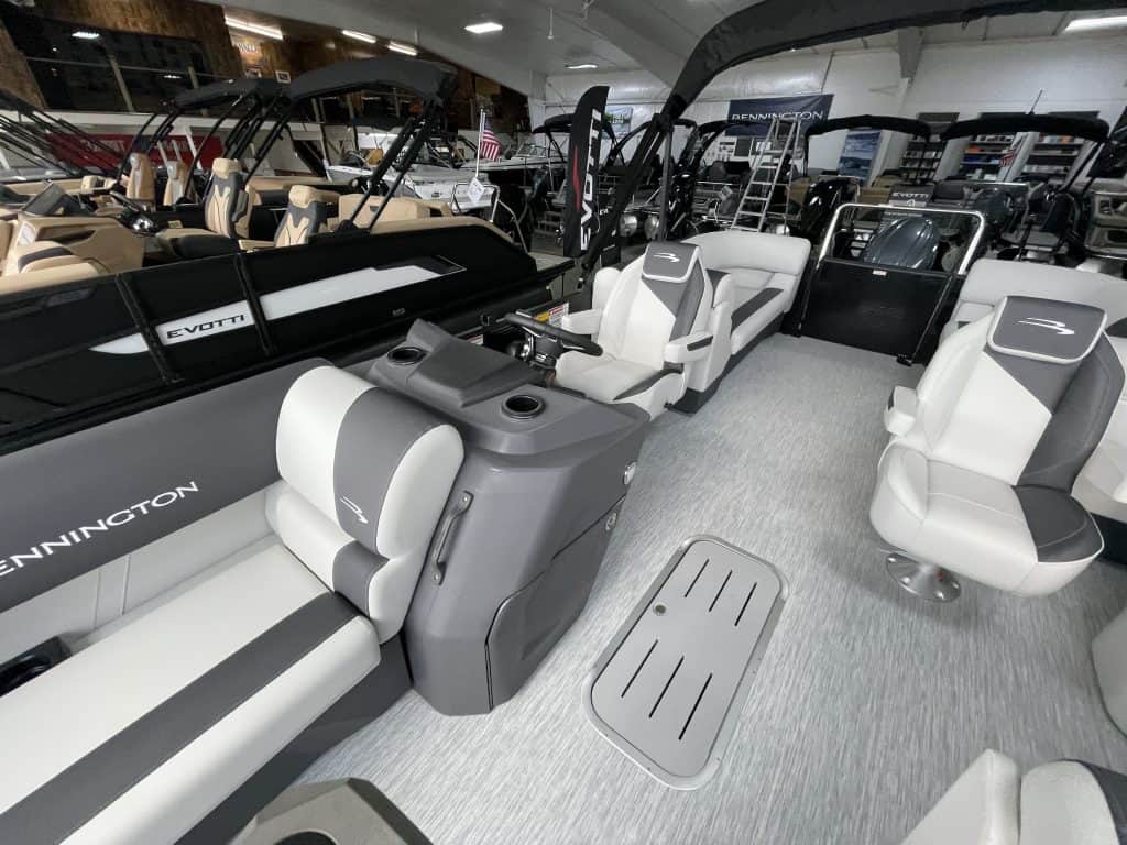 Bennington 22 S1SR pontoon boat interior with seating and steering console.