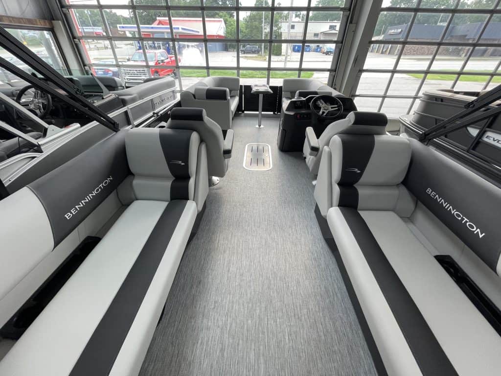 Bennington pontoon boat interior with seating and steering console.