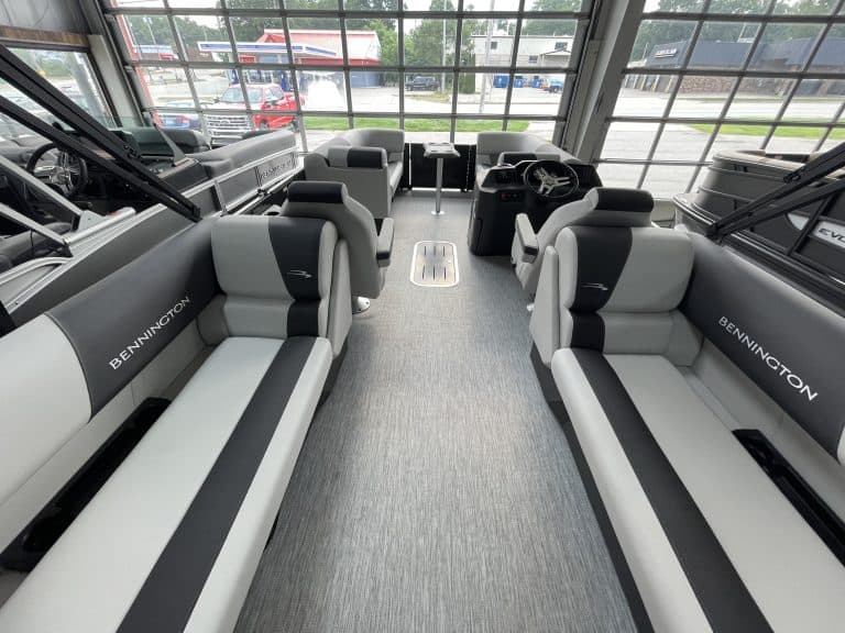 Bennington pontoon boat interior with seating and steering console.