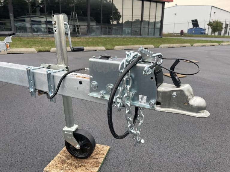 Close-up of a trailer hitch and wheel at Hall's Sport Center.