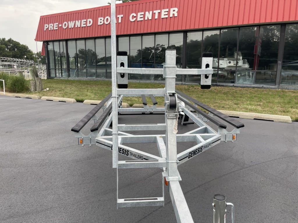 Genesis PF22T boat trailer parked outside Hall's Sport Center.