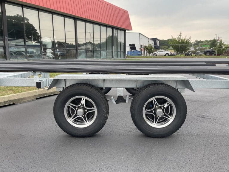 Close-up of trailer wheels at Hall's Sport Center parking lot.