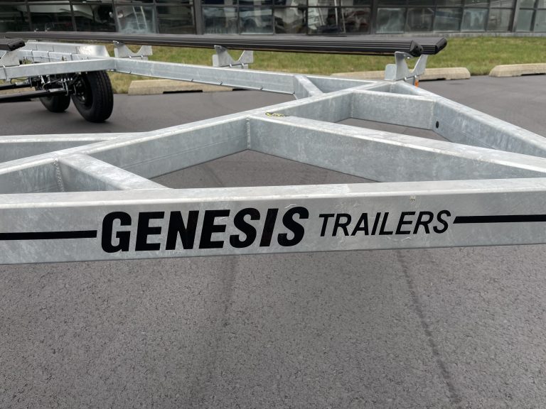 Metal Genesis trailers parked outside Hall's Sport Center for sports equipment transport.