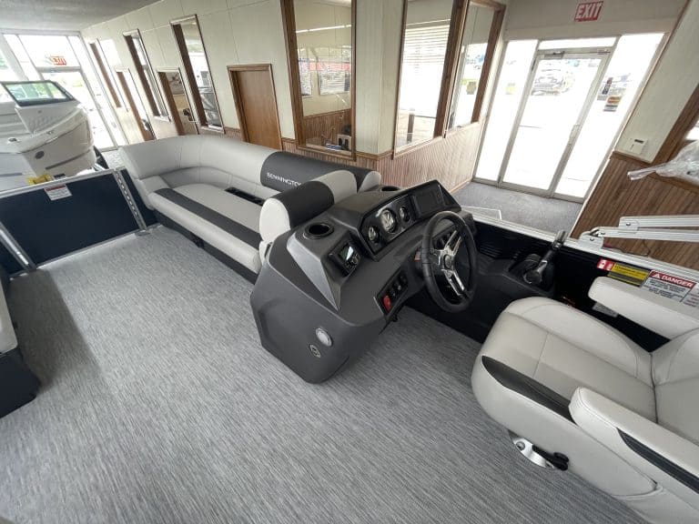 Boat helm station with steering wheel and controls at Hall's Sport Center.