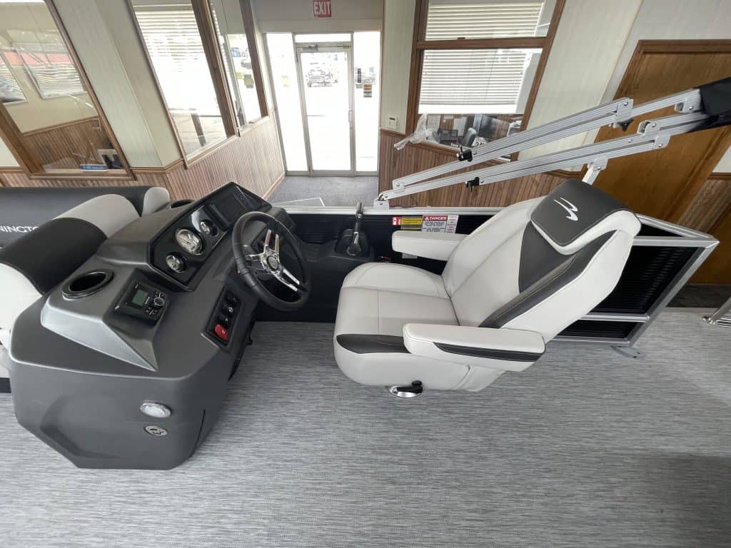 Boat helm with steering wheel and controls at Hall's Sport Center.