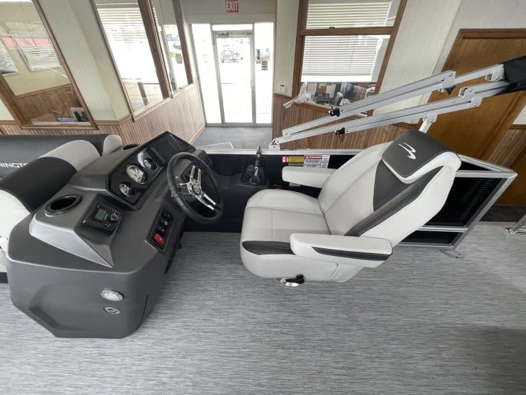 Boat helm with steering wheel and controls at Hall's Sport Center.