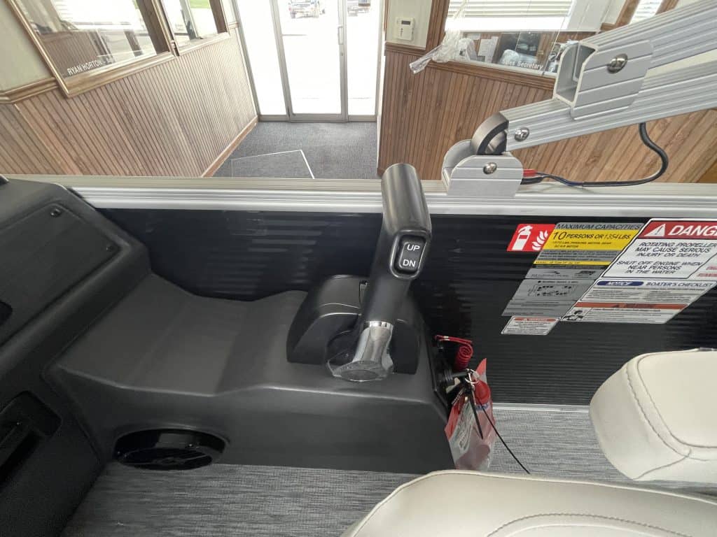 Boat control console with steering and throttle in Hall's Sport Center.