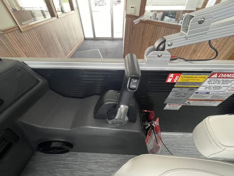 Boat control console with steering and throttle in Hall's Sport Center.