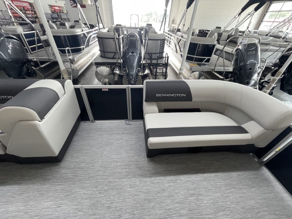 Bennington pontoon boat with seating at Hall's Sport Center marina.