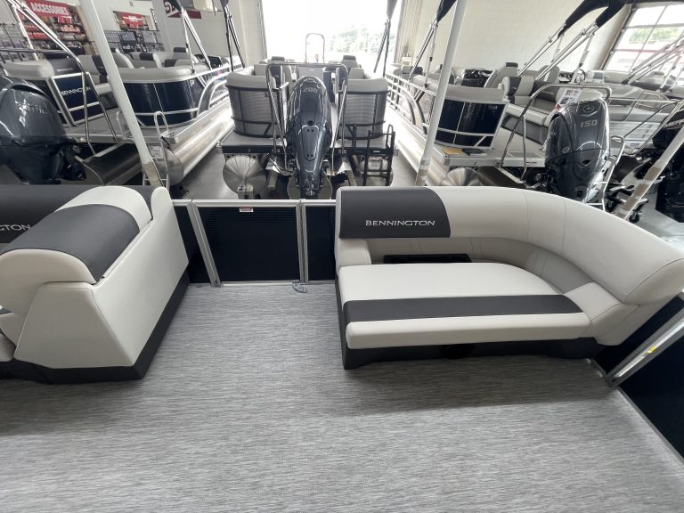 Bennington pontoon boat with seating at Hall's Sport Center marina.