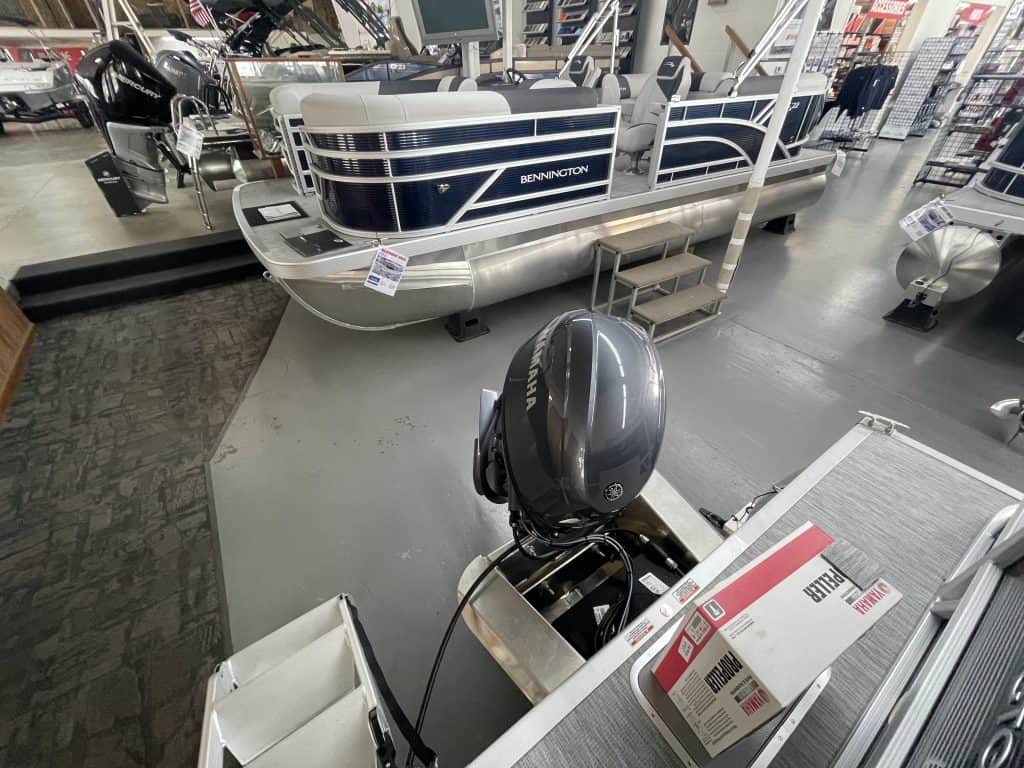 Bennington pontoon boat displayed at Hall's Sport Center showroom.
