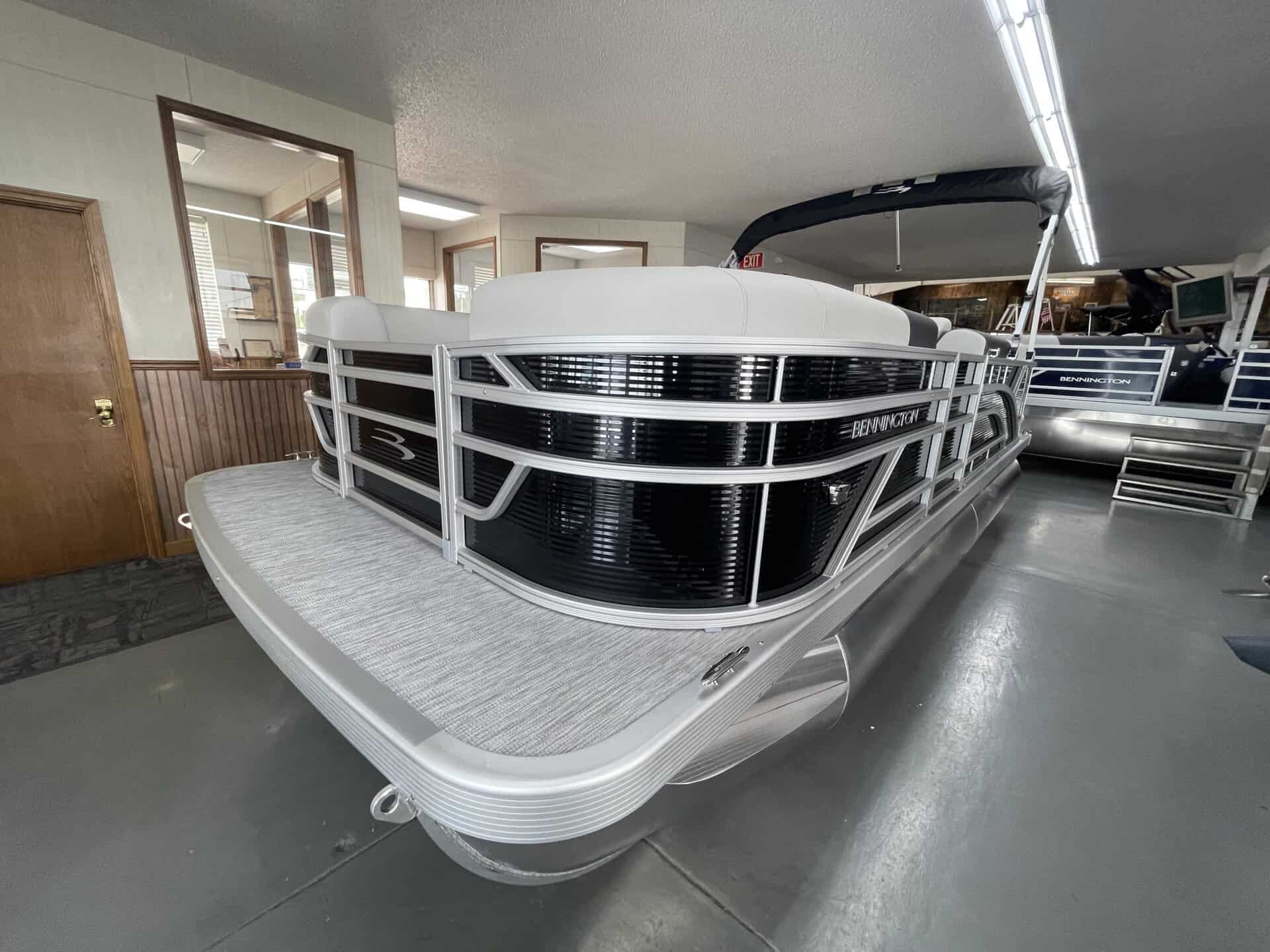 Bennington 20 S1L pontoon boat inside Hall's Sport Center.