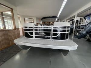 Pontoon boat displayed at Hall's Sport Center for sale or rent.