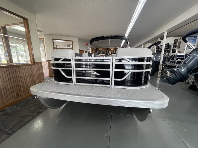 Pontoon boat displayed at Hall's Sport Center for sale or rent.