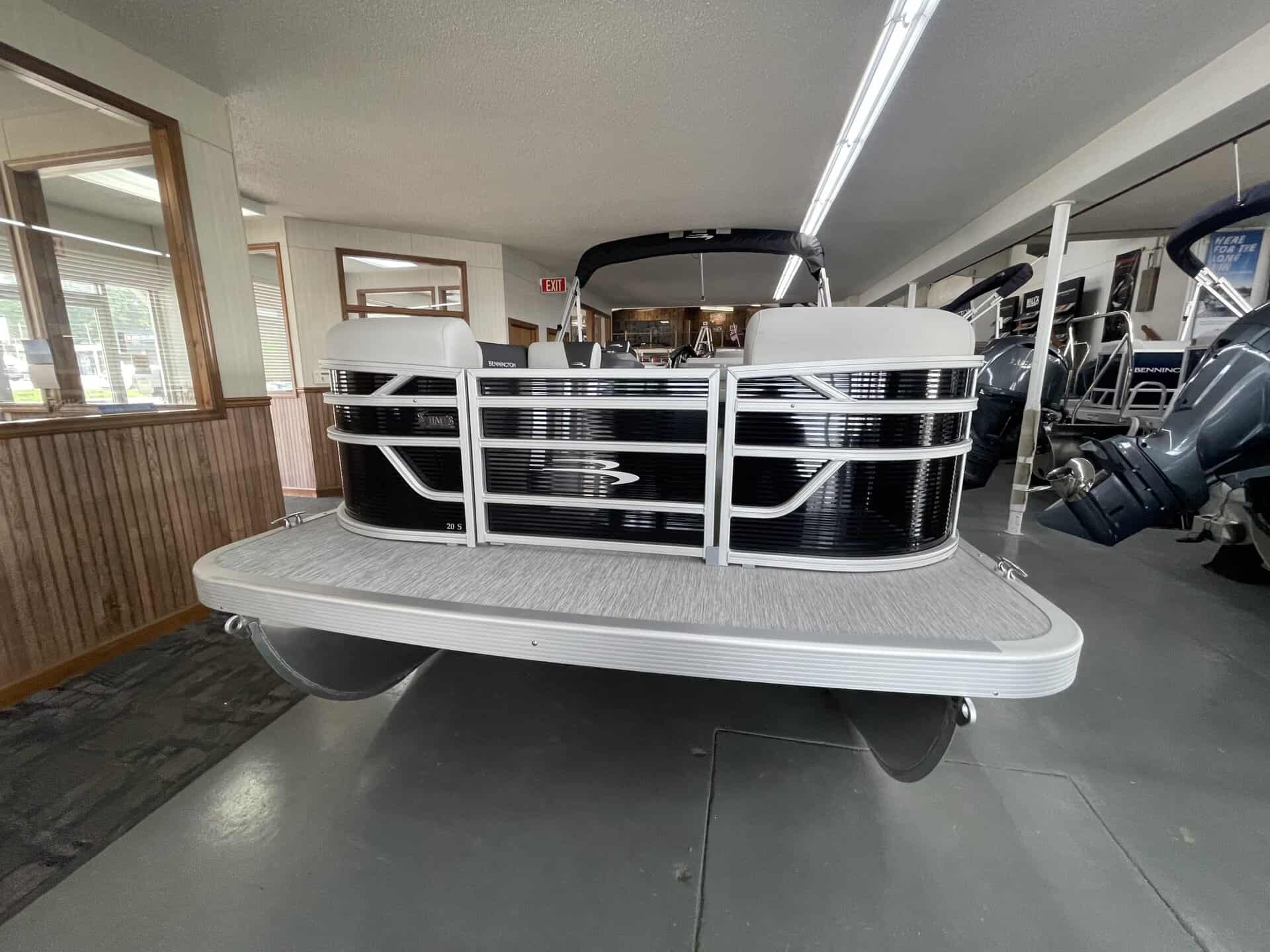 Pontoon boat displayed at Hall's Sport Center for sale or rent.