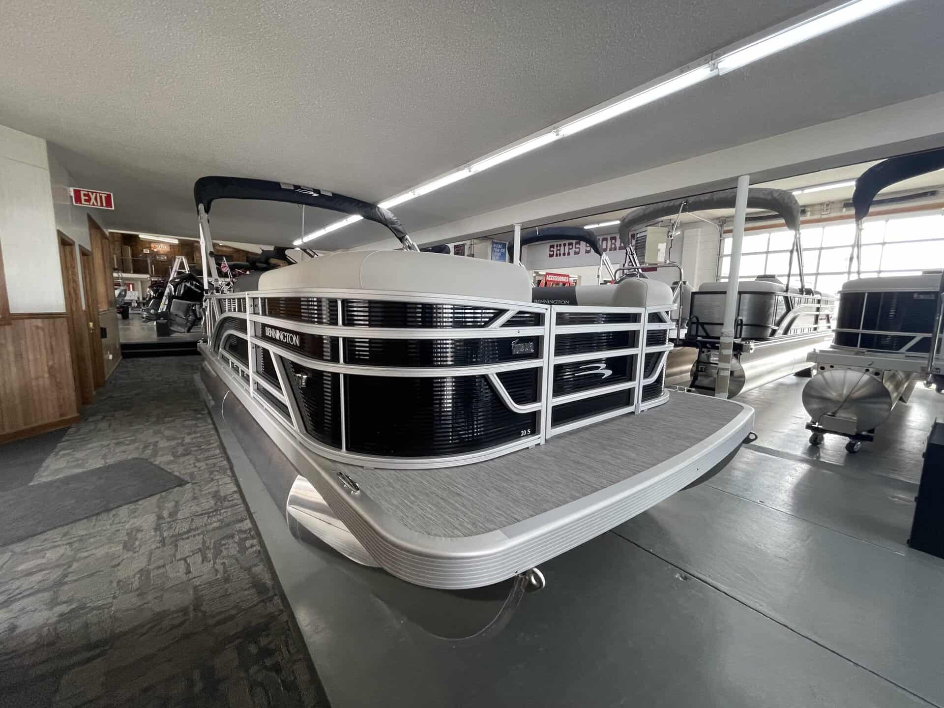 Bennington 20 S1L pontoon boat displayed indoors at Hall's Sport Center.