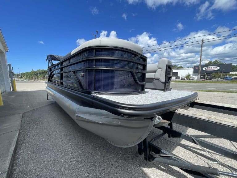 Bennington 22S1 SSR pontoon boat with black and gray exterior on trailer.