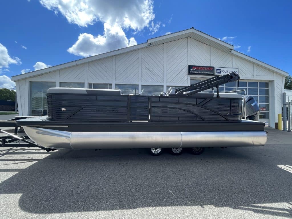 Bennington 22S1 SSR pontoon boat parked outside Hall's Sport Center.