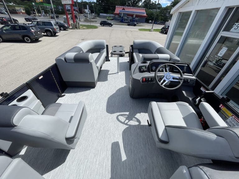 View of the cockpit and seating area of a Bennington 22S1 SSR pontoon boat.
